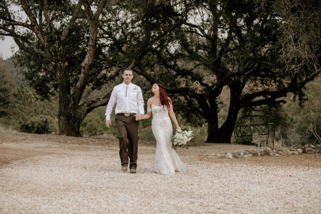 bride-walking-with-groom-in-oak-trees