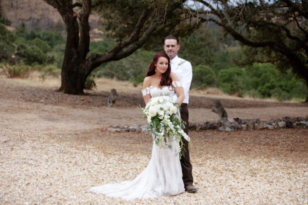 stunning couple under the oak trees