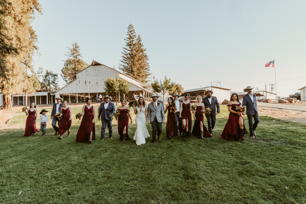 bridal party with barn