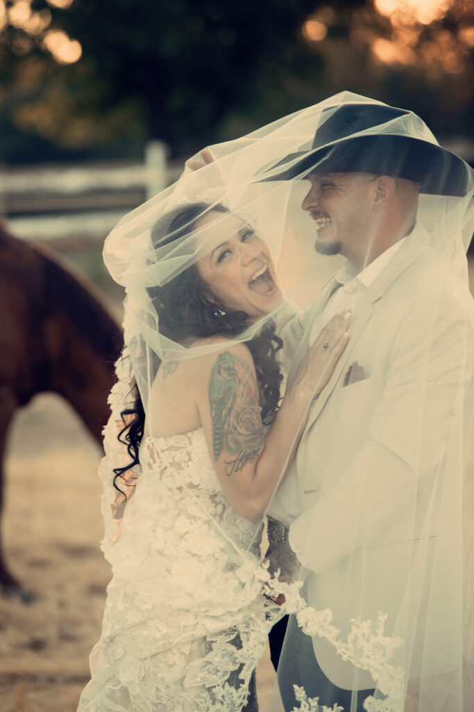 bride and groom under viel