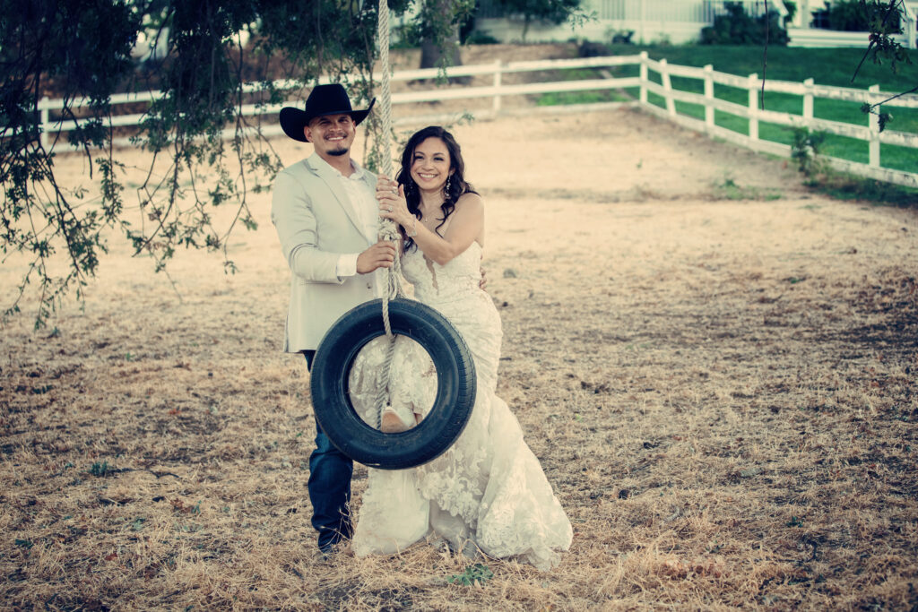 Bride and groom with tire swing